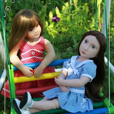 Tinka and Mattie on a swing